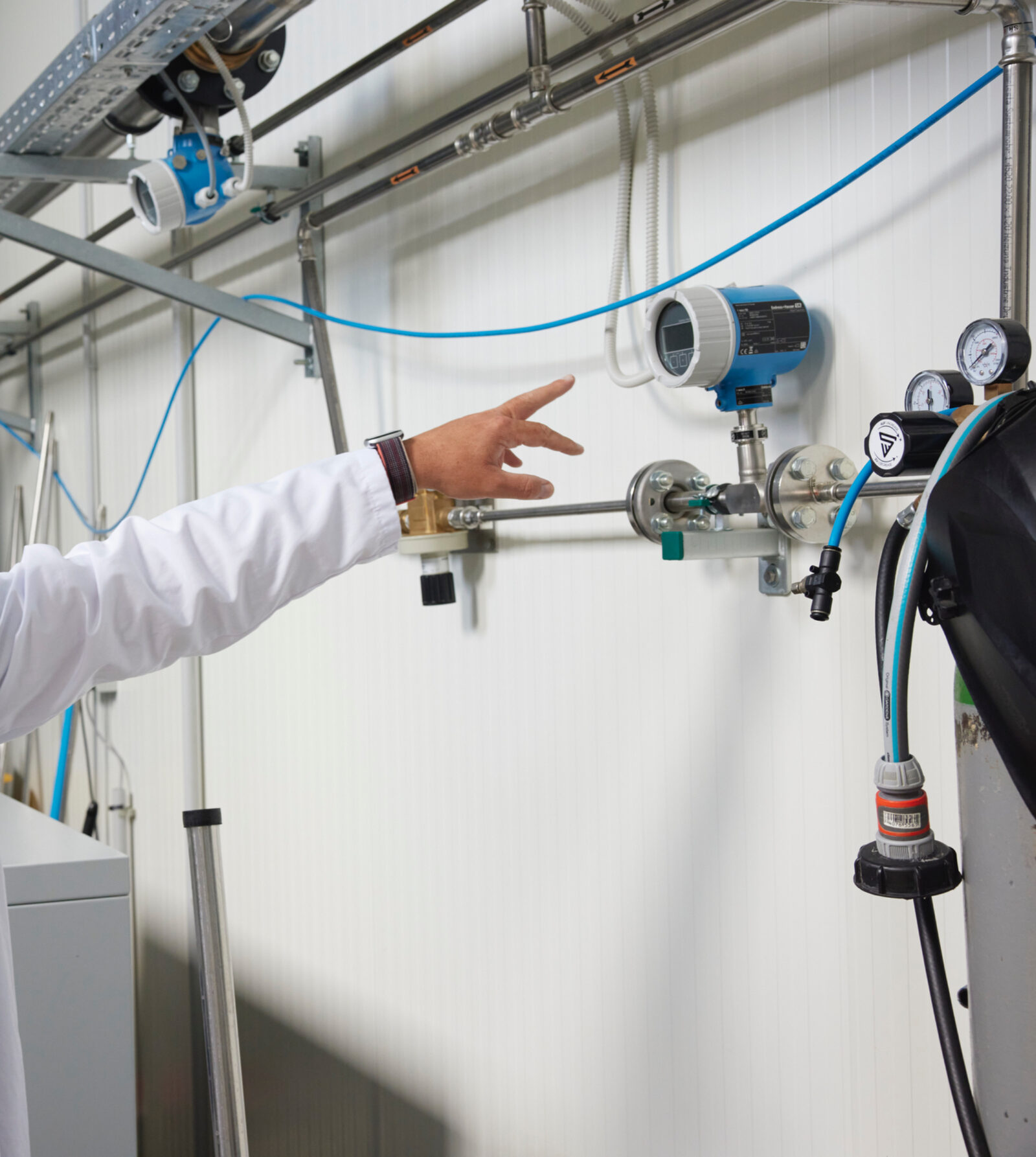 AQVION engineer reviewing water-treatment instrumentation and control